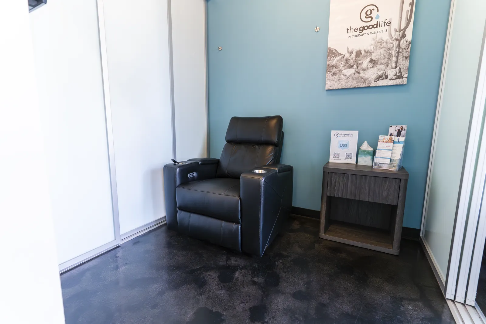 A private treatment room with one recliner and a side table